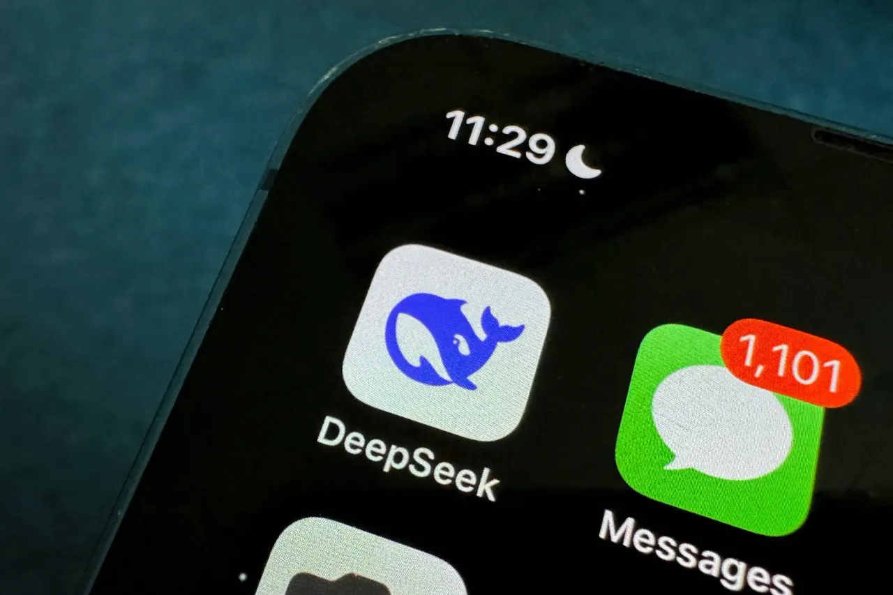 DeepSeek logo on a smartphone screen with Chinese yuan banknotes in the background, symbolising a $15 billion funding round