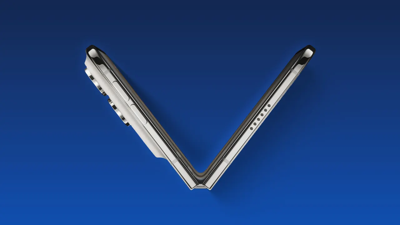 A foldable iPhone Duo shown half-open on a desk next to a production-line graphic suggesting increased manufacturing orders.