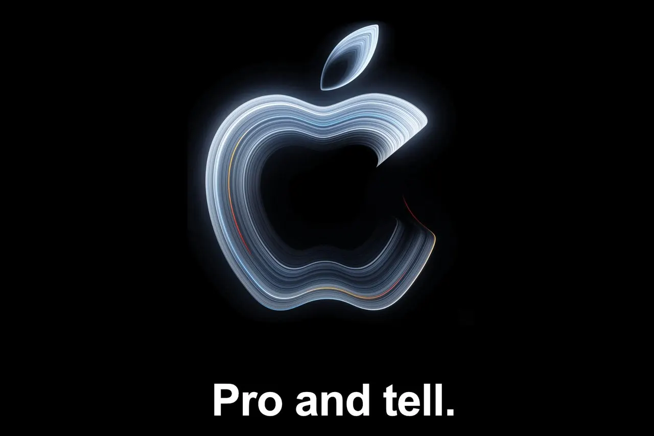 A silver MacBook Pro laptop with an open display on a dark stage backdrop, illustrating Apple's upcoming Pro and tell event.