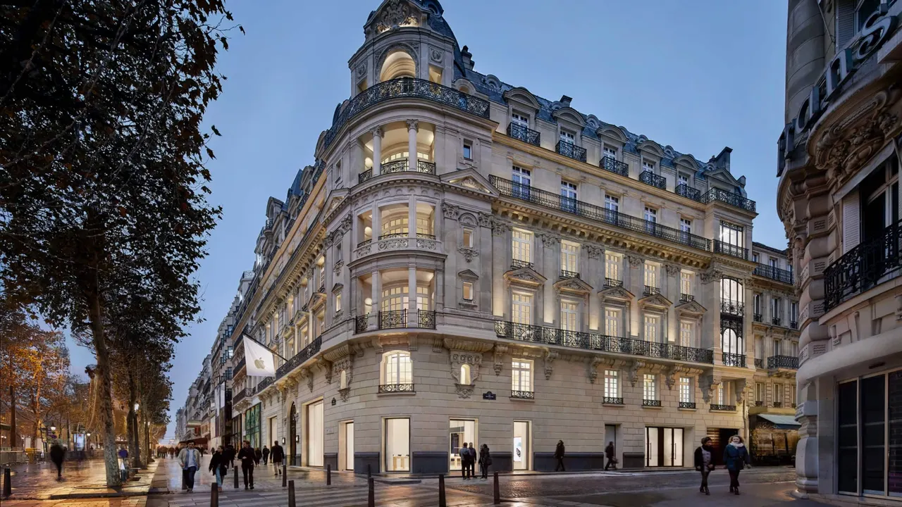 Closed Apple Store with shuttered street-facing entrance on a Paris street
