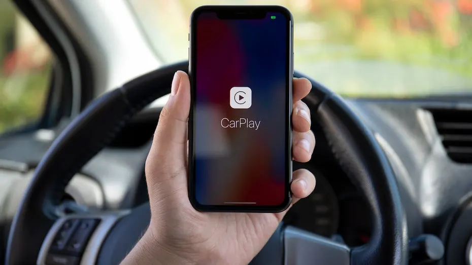 A car dashboard screen running Apple CarPlay with Google Maps navigation and the Gemini star icon on the right side.