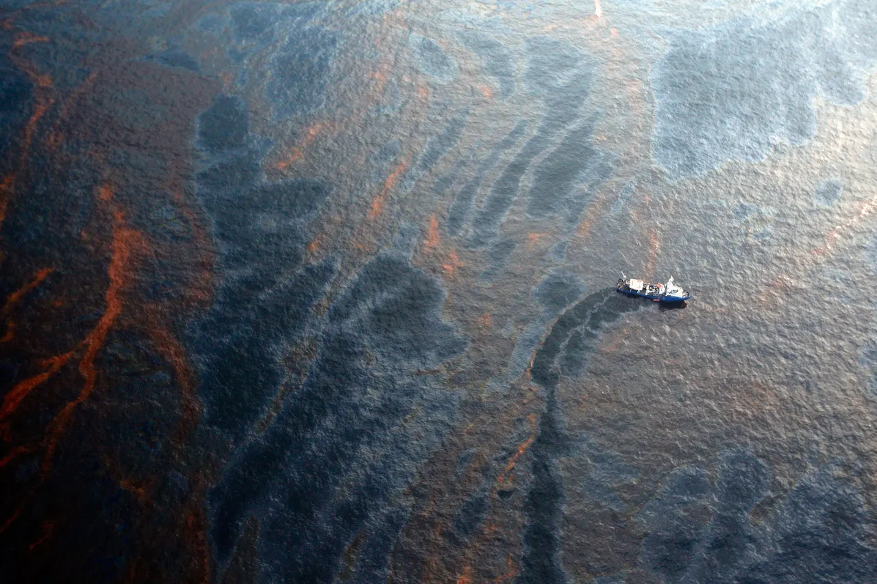 Research vessel on the Gulf of Mexico lowering a plankton net into deep water near the site of the Deepwater Horizon spill.