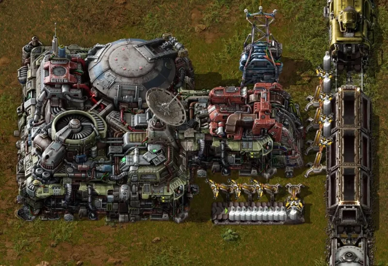 Screenshot of a sprawling automated factory with conveyor belts and machines in the game Factorio.