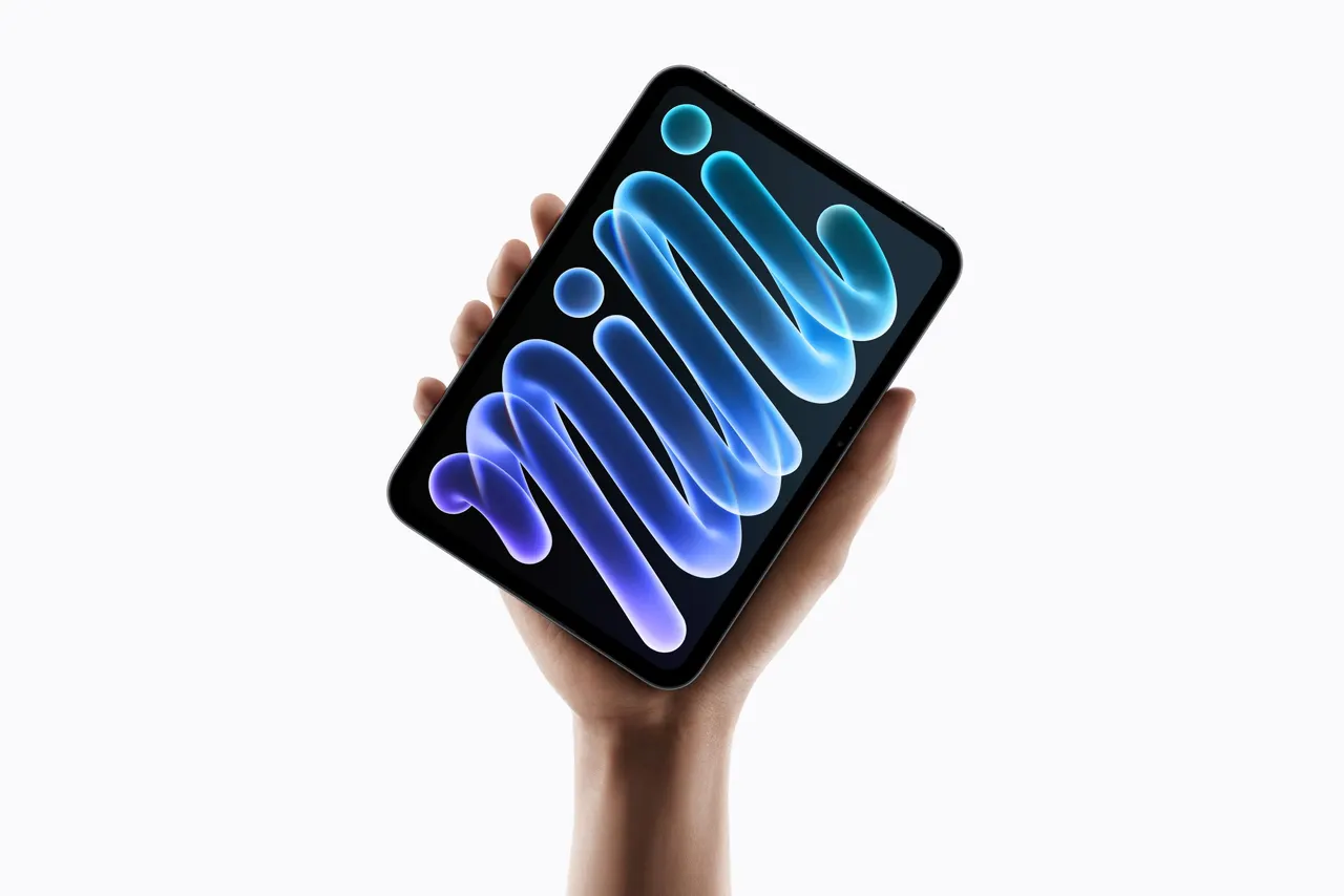 Apple's new iPad mini with an 8.5-inch OLED display shown in midnight and starlight finishes.