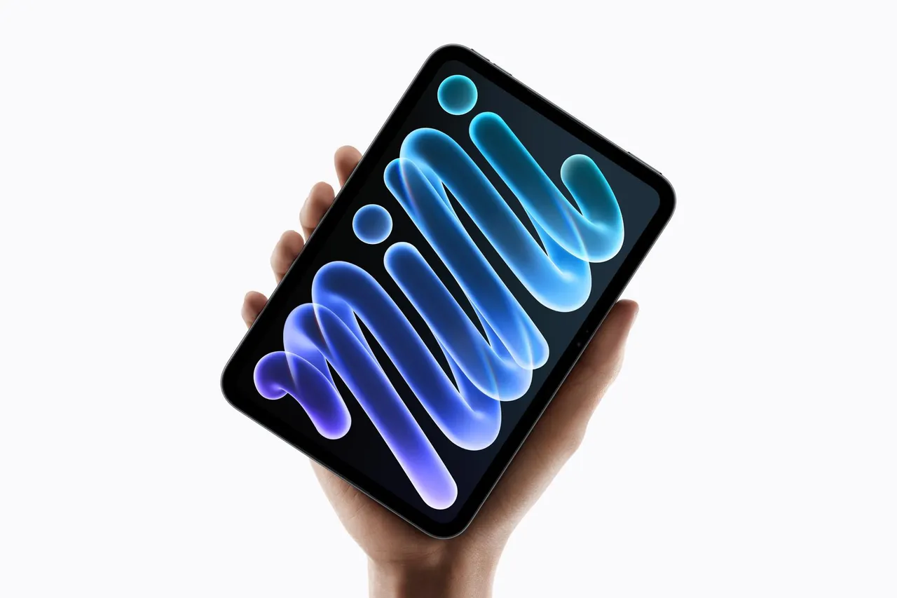 The new iPad Mini with an 8.5-inch OLED display shown in midnight and starlight colors.