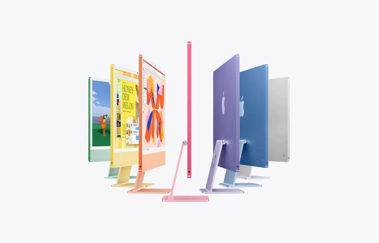 A new 24-inch iMac with a 4.5K Retina display shown in bright colors on a desk with matching Magic Keyboard and Magic Mouse.