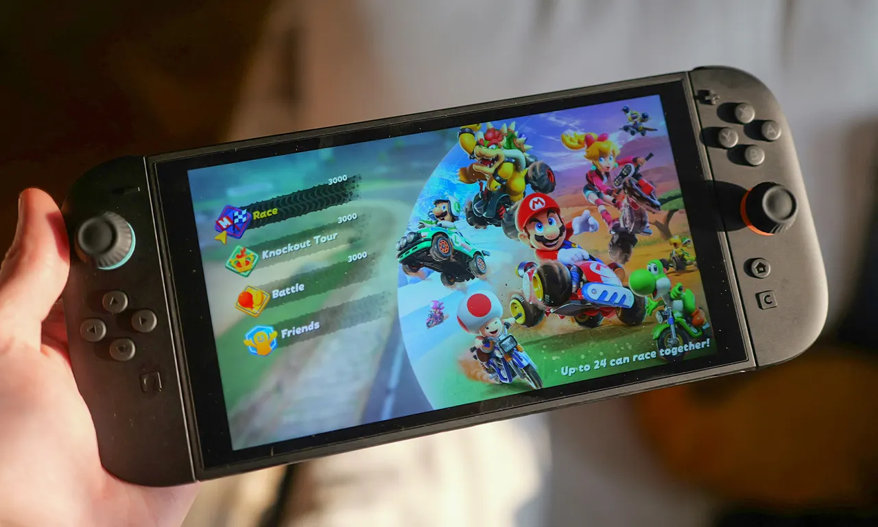 An iPhone showing a Nintendo Switch game running as a native app next to a Mac and iPad.