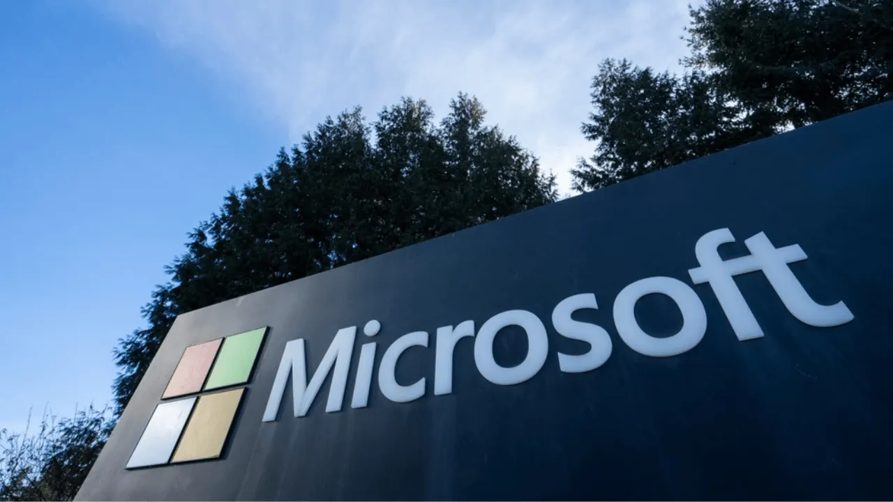 Microsoft corporate campus building with the company logo, illustrating the voluntary separation offer to employees.