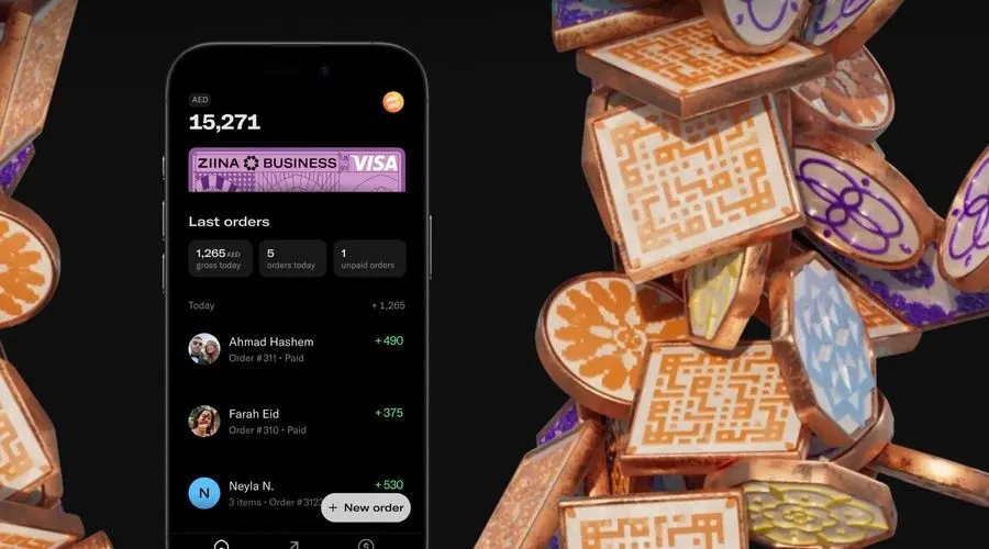 Smartphone showing the Ziina payments app next to a contactless card terminal in a modern UAE retail setting.