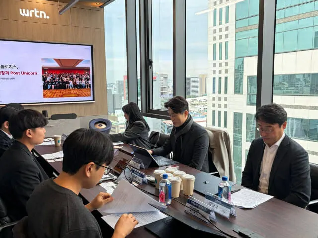 South Korean vice minister meeting AI startup founders at a roundtable inside the Seoul office of Wrtn Technologies.