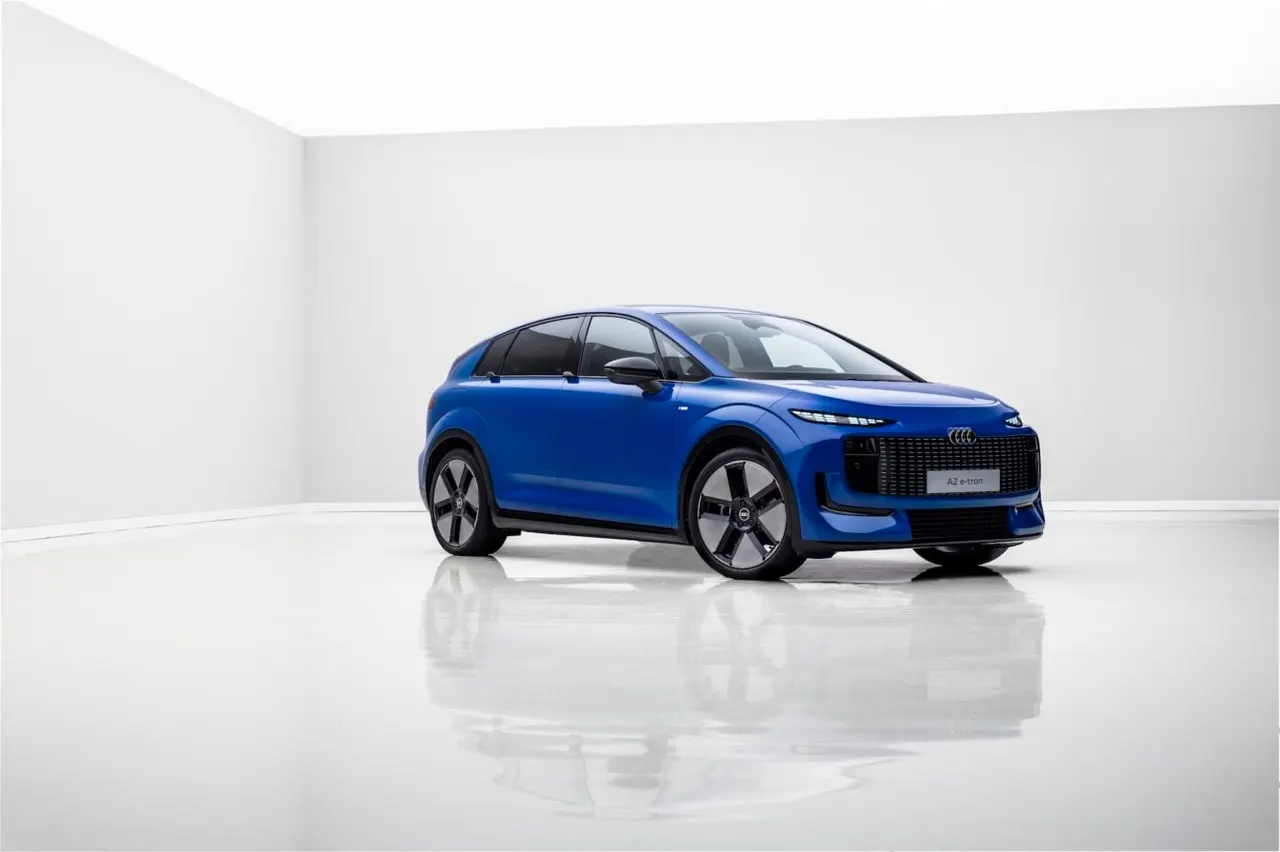 Audi A2 e-tron electric compact car shown from the front three-quarter angle on a road.