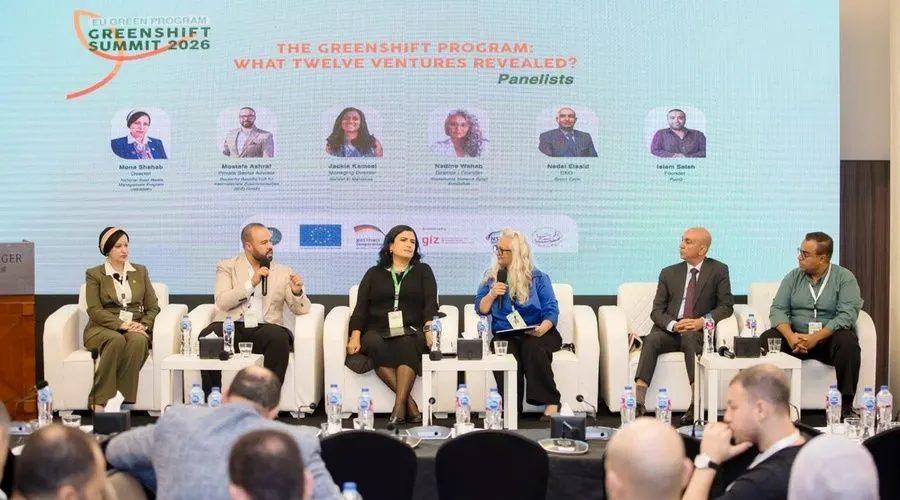 Entrepreneurs and officials on stage at the GreenShift Summit in Cairo celebrating the graduation of 12 green startups.