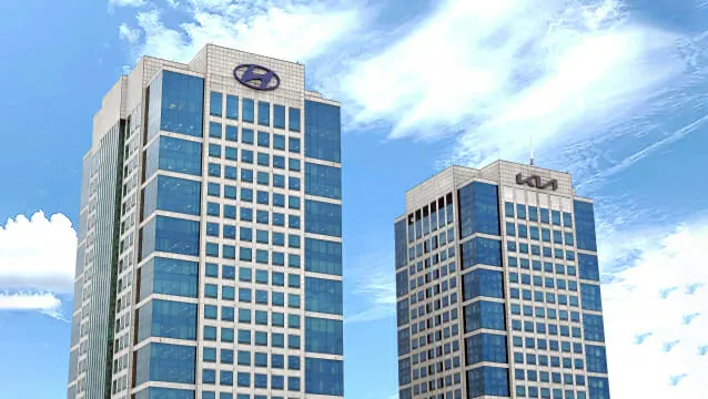 Hyundai and Kia vehicles with a digital software interface overlay representing the software-defined vehicle strategy of subsidiary 42dot.