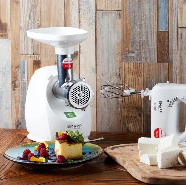 A compact electric kettle, hand mixer and meat grinder from the Polish SMAPP kitchen appliance brand displayed together.
