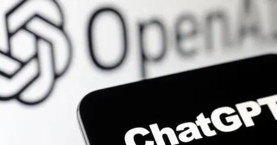 A ChatGPT chat window beside a ServiceNow incident dashboard on an office monitor, illustrating AI-driven workplace tasks.