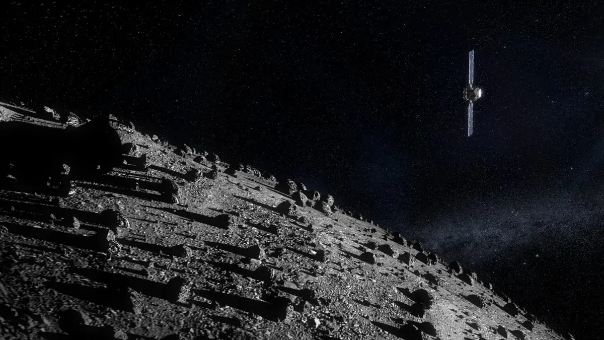 Black-and-white spacecraft image showing the asteroid Didymos and its tiny moonlet Dimorphos as two separate bright dots against dark space.