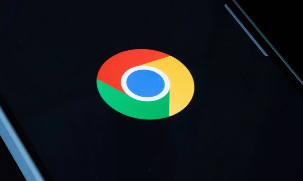 Google Chrome browser window with a warning symbol over the extensions menu