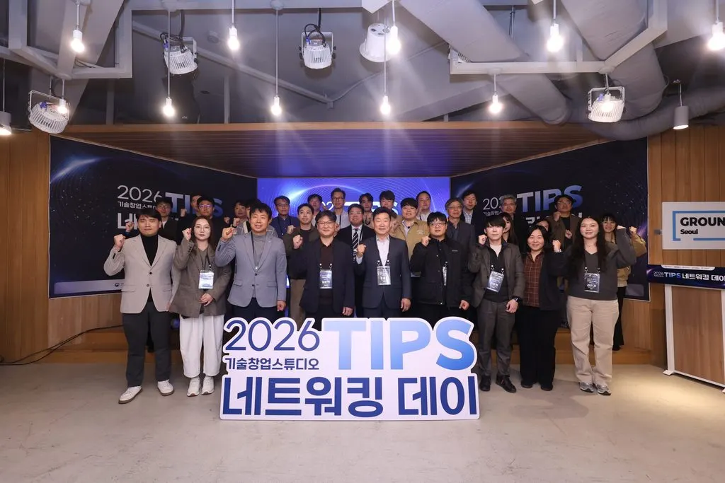 Startup founders pitching on an IR stage to investors at a networking event in Seoul's Gangnam district.