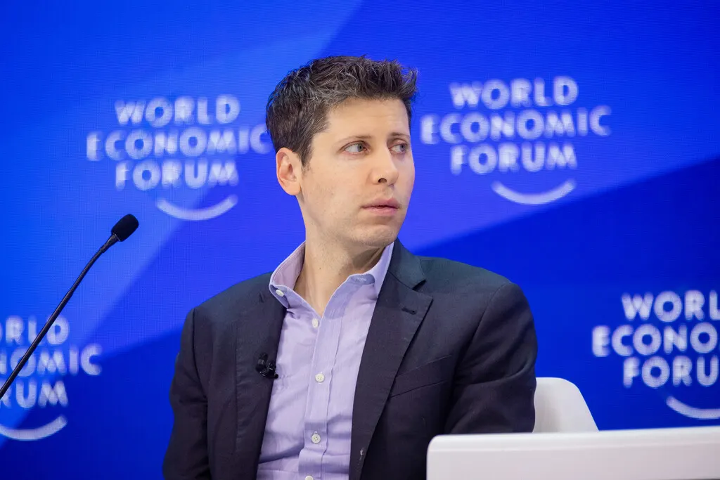 Sam Altman, CEO of OpenAI, speaking on stage during an interview about the risks and benefits of artificial intelligence.
