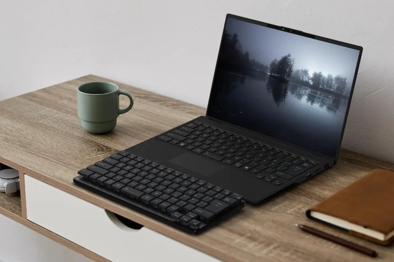A low-profile FMV Keyboard X with a Japanese JIS-style layout and compact cursor keys on a desk.