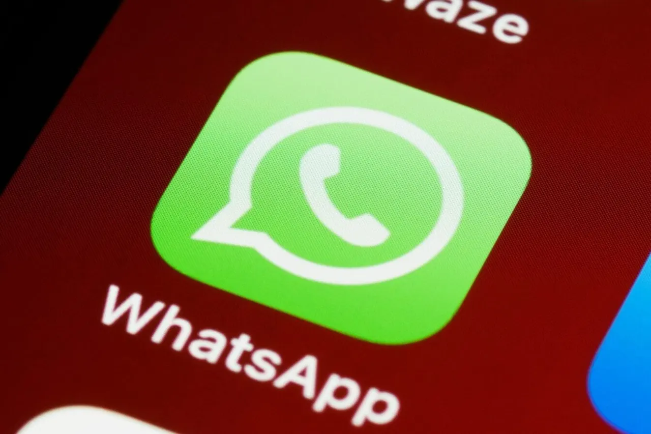 Smartphone showing a WhatsApp chat with a suspicious message asking the user to vote in a dance contest.