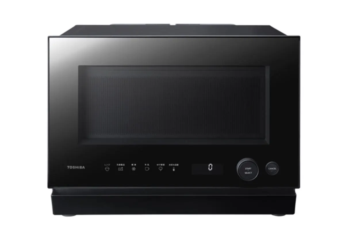 A compact Toshiba single-function microwave oven with a semiconductor heating system, shown on a kitchen counter.