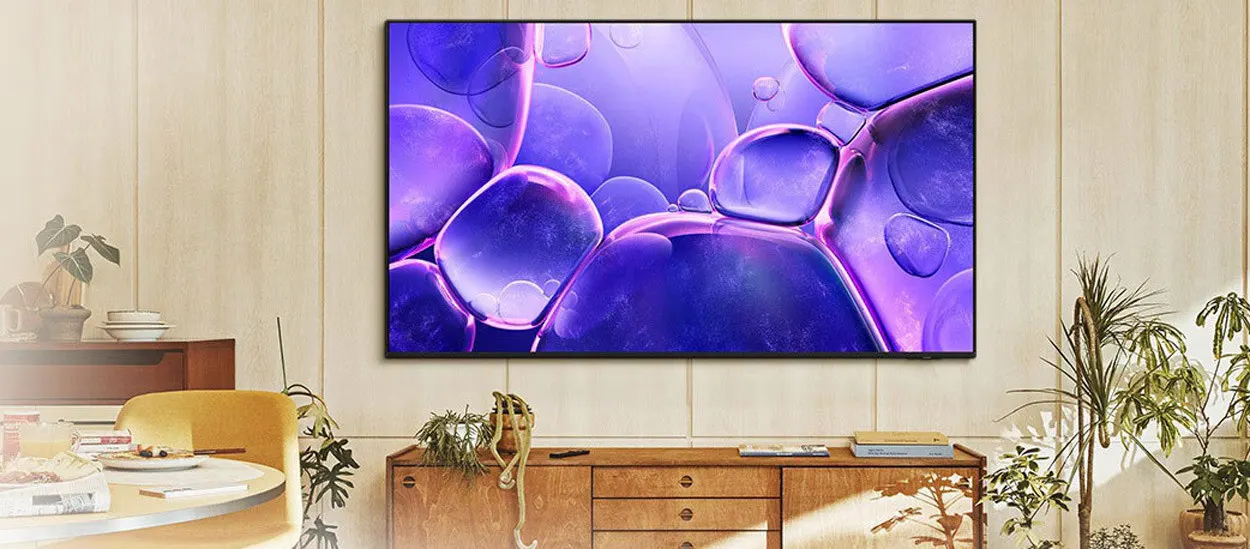 A Samsung smart TV in a living room with a soundbar underneath, illustrating concerns about hidden microphones.