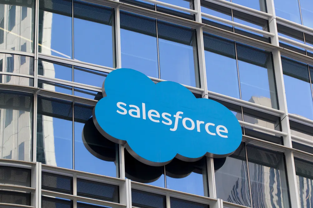 Salesforce logo beside an abstract illustration of military artificial intelligence software on a dark background.