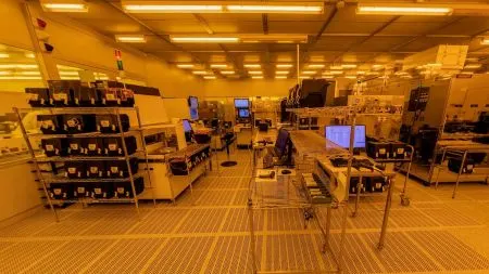 Silicon wafers in a semiconductor cleanroom at a chip fab producing power MOSFETs.