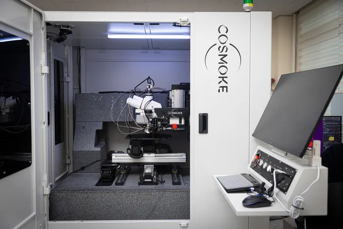 Semiconductor wafer inspection equipment measuring magnetic thin films in a cleanroom fabrication line.