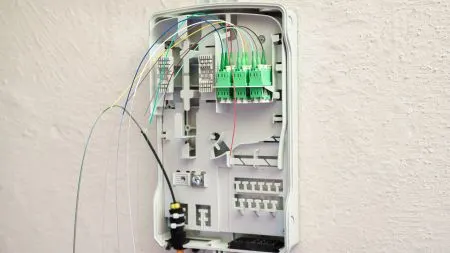 Fibre-optic cables being installed in the basement of a residential apartment building.