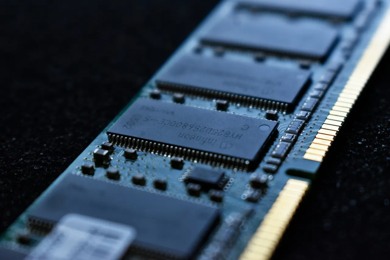Close-up of a memory chip on a circuit board beside stacked memory layers, illustrating the Z2RAM concept.
