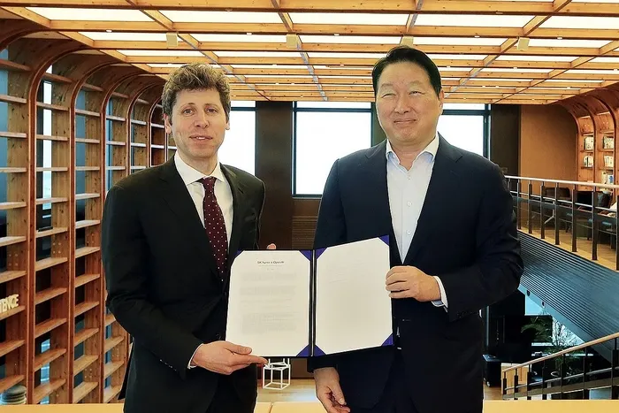 Two executives shake hands at a business lunch in Seoul, with AI data center and memory chip imagery in the background.